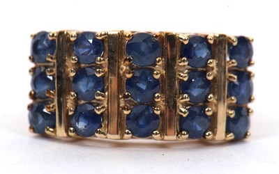 Lot 10 - A 9ct stone blue gemset ring, the three rows...