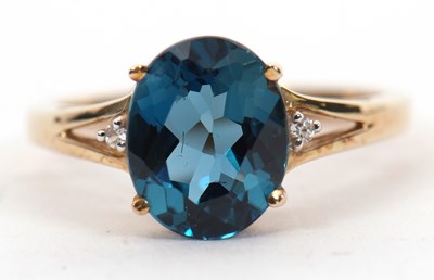 Lot 6 - A 9ct 'London Blue' topaz and white stone ring,...