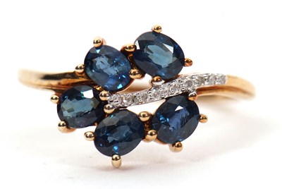 Lot 7 - A 9ct blue stone and diamond ring, the leaf...