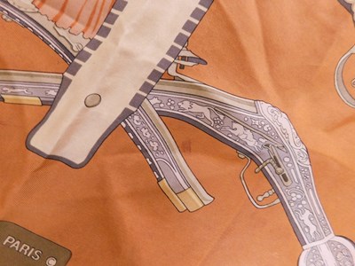 Lot 116 - An Hermes 'Diane' scarf, in shades of brown,...