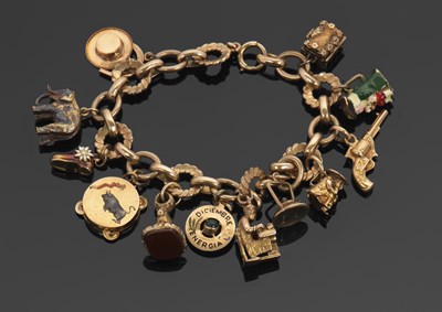 Lot 467 - A 9ct charm bracelet, the fancy link bracelet...