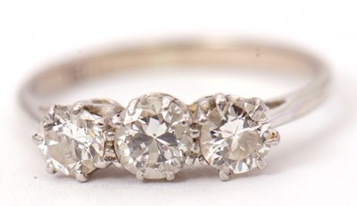 Lot 61 - An 18ct three stone diamond ring, the three...