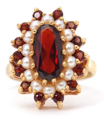 Lot 49 - A 9ct garnet and cultured pearl ring, the oval...