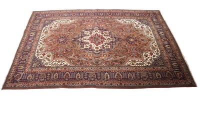 Lot 586 - Large Tabriz rug, blue and red ground with...