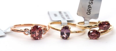 Lot 125 - Three gemset rings: to include a 9ct purple...