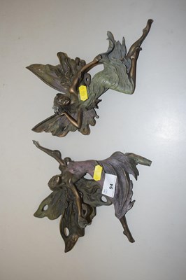 Lot 94 - A pair of bronzed resin wall mounted fairies