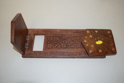 Lot 97 - A hardwood sliding book rack