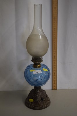 Lot 20 - Cast based oil lamp with blue glass font