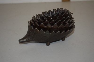 Lot 103 - A Greek cast metal hedgehog stacking ashtray