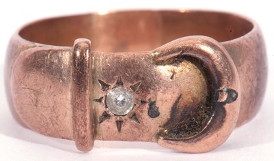 Lot 6 - 9ct rose gold buckle ring highlighted with a...