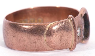 Lot 6 - 9ct rose gold buckle ring highlighted with a...
