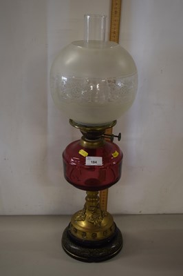 Lot 184 - Oil lamp with cranberry tinted font and...