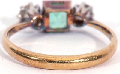Lot 11 - Emerald and diamond three-stone ring, the...