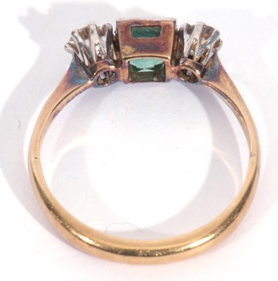 Lot 11 - Emerald and diamond three-stone ring, the...