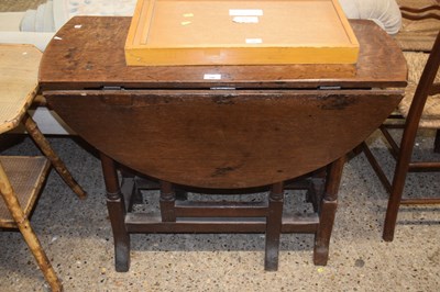 Lot 346 - 18th Century oak drop leaf table on braganza legs