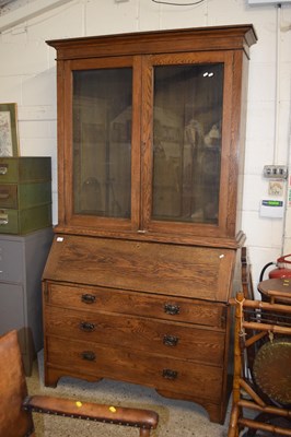 Lot 391 - Late 19th century oak bureau bookcase with...