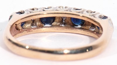 Lot 38 - 9ct gold sapphire and diamond half hoop ring,...