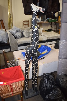 Lot 727 - A freestanding wooden giraffe