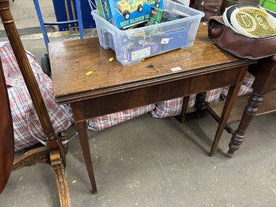 Lot 782 - A mahogany fold out tea table