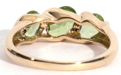 Lot 53 - Modern three green stone ring, stamped 9K,...