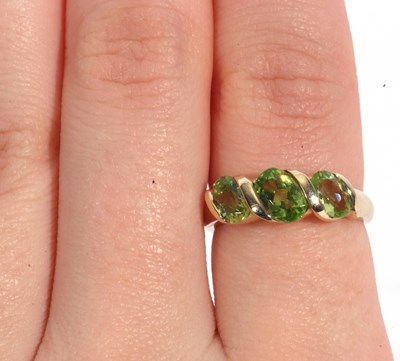 Lot 53 - Modern three green stone ring, stamped 9K,...