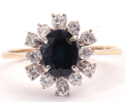 Lot 56 - Modern sapphire and diamond cluster ring, the...