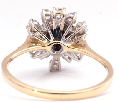 Lot 56 - Modern sapphire and diamond cluster ring, the...