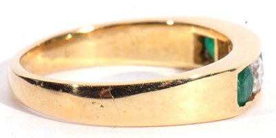 Lot 85 - 18ct gold emerald and diamond half hoop ring...
