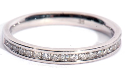 Lot 93 - Platinum and diamond half eternity ring,...