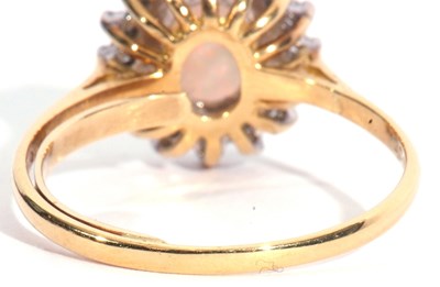 Lot 94 - 18ct gold opal and diamond cluster ring, the...