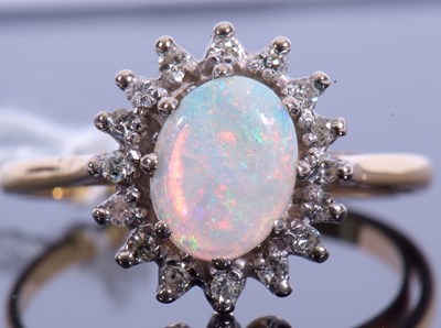 Lot 94 - 18ct gold opal and diamond cluster ring, the...