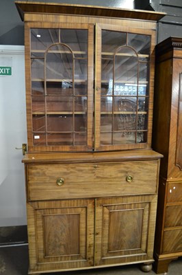 Lot 521 - A Georgian mahogany secretaire cabinet with...