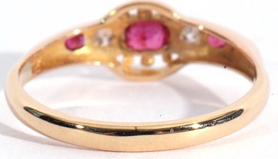 Lot 98 - Ruby and diamond ring, line set with three...