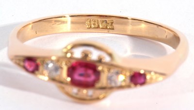 Lot 98 - Ruby and diamond ring, line set with three...