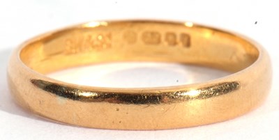 Lot 99 - 22ct gold wedding ring of plain polished...