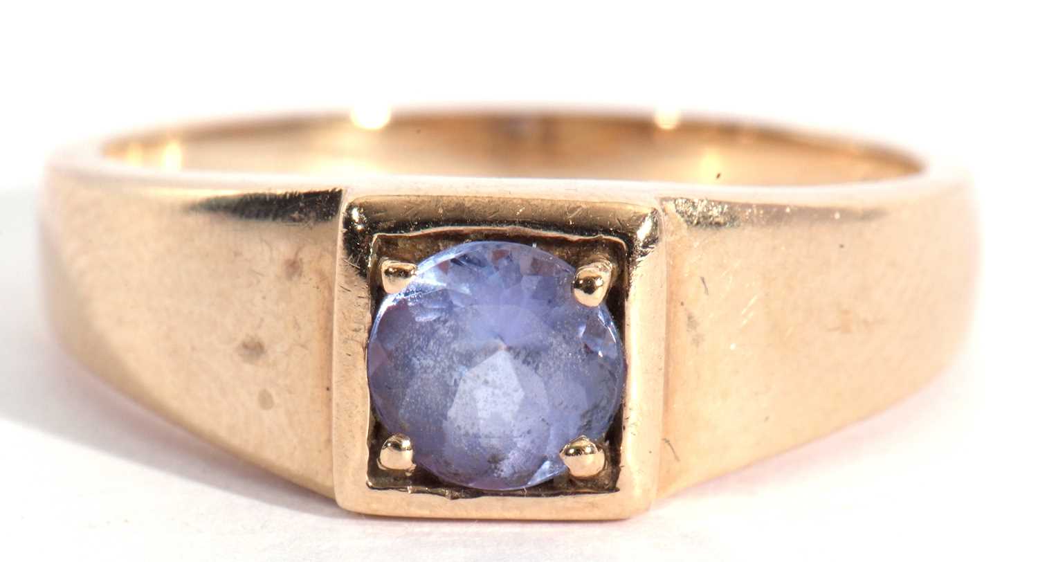 Lot 106 - Modern 9ct gold and tanzanite ring, the round...