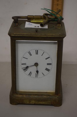 Lot 34 - A French brass cased striking mantel clock,...