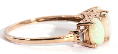 Lot 111 - Modern 9ct gold white opal three stone ring,...