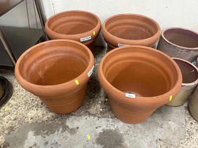 Lot 1029 - Four large terracotta plant pots