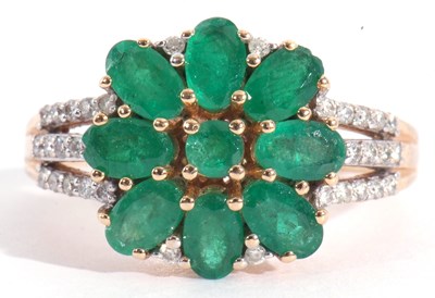 Lot 115 - Modern 18ct gold emerald and diamond cluster...