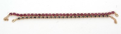 Lot 237 - Two 9ct gemset bracelets: to include a blue...