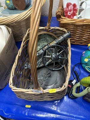 Lot 524 - Wicker basket containing assorted metal wares...