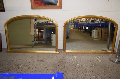 Lot 243 - A pair of modern overmantel mirrors in gilt...