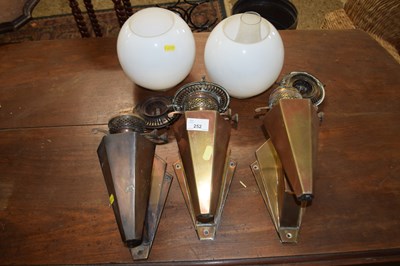 Lot 252 - Set of three wall mounted oil lamps, two with...