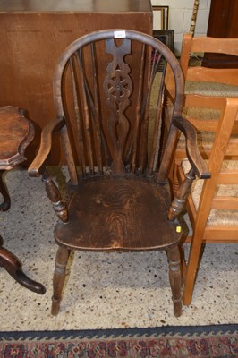 Lot 272 - Early 20th Century elm seated wheel back...