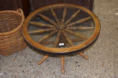 Lot 300 - Modern glass top and oak ships wheel type...