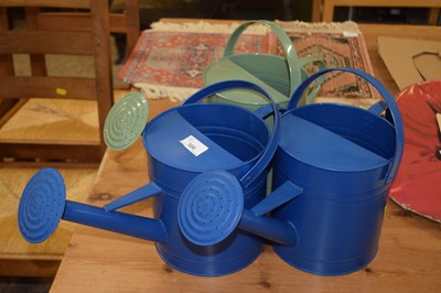 Lot 308 - Three modern metal watering cans