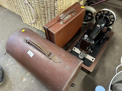 Lot 774 - A vintage Empress sewing machine together with...