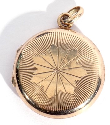 Lot 168 - 9ct gold small round shaped hinged locket, the...