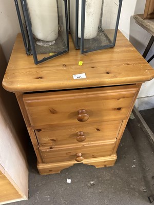 Lot 681 - A three drawer pine bedside chest